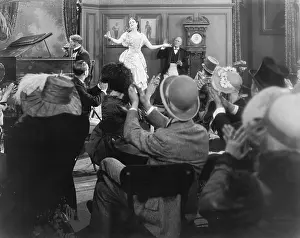 Applaud: Young woman performing for a group of spectators