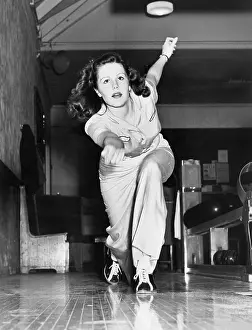 Long Haired: Young woman playing bowling