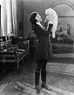 Couches: Young woman playing with her dog