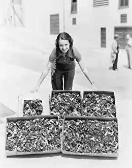 Boxed: Young woman presenting poppies in a box