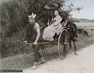 Jinrikisha: Young woman being pulled in a rickshaw jinrikisha