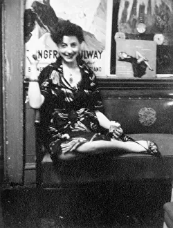 Slinky: Young woman sitting on a bench