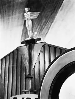 Emblematic: Young woman standing like a statue