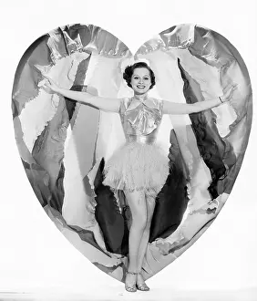 Heart Shaped: Young woman stepping out of a heart