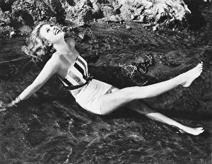 Sunning: Young woman sunning herself in the ocean
