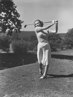 Teeing: Young Woman Teeing Off