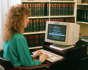 Solicitors: Young woman working at a computer in a solicitors office