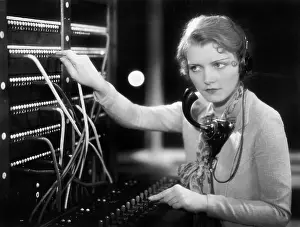 Employ: Young woman working as a telephone operator