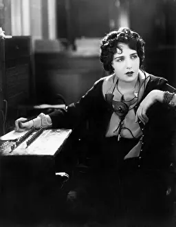 Employ: Young woman working as a telephone operator