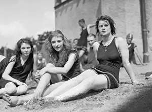Young Women: Three young women in bathing suits on sandy beach