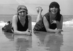 Surf: Two young women on a beach