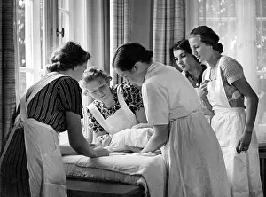 Diaper: Young women learn about diapering during a course
