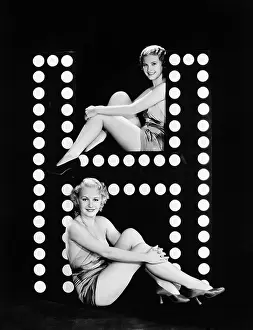 Imagining: Two young women posing with the letter H