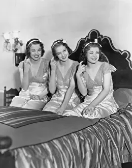 Wink: Three young women winking