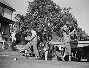 Recycling: Youngsters help load a truck with scrap metal