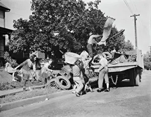 Donation: Youngsters help load a truck with scrap metal