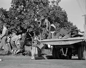 Donation: Youngsters help load a truck with scrap metal