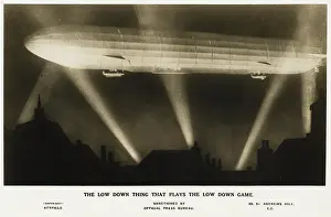 Zeppelin illuminated by searchlights