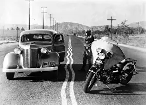 Prompt: Zigzag mark on a highway, 1936